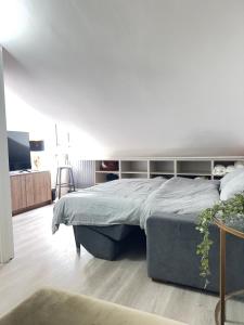 a bedroom with a large bed in a room at Nice and cozy apprtment in Murazzano with panoramic view in Murazzano