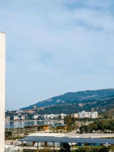 a view of a city and a body of water at Radhima Beach Apartments in Vlorë