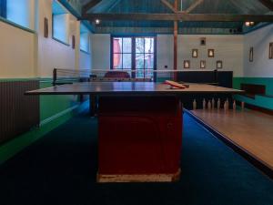 a ping pong table in the middle of a room at Royal Oak House in Shaftesbury +72 photos