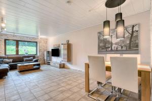 a living room with a table and a couch at Am Linnert in Haltern