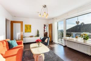 a living room with a couch and a table at Ferienwohnung In den Haargärten in Möhnesee