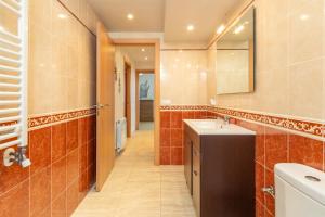 a bathroom with a sink and a mirror at Planta Baixa in Platja d'Aro +12 photos