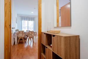 a kitchen with a table and a dining room at Apartamentos de Ángel in Vinebre +14 photos