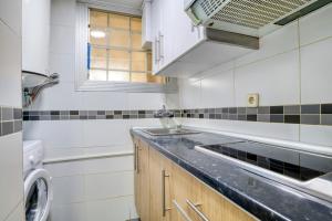a kitchen with a sink and a counter top at Nice apartment with terrace in Lloret de Mar