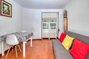 a living room with a couch and a table at Nice apartment with terrace in Lloret de Mar +12 photos