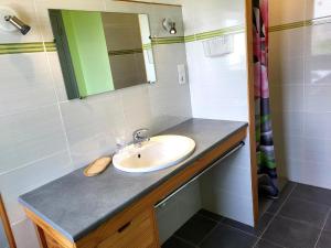 a bathroom with a sink and a mirror at Maison De Bord De Mer Alizée in Saint-Germain-sur-Ay +23 photos
