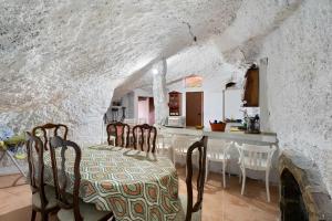 a kitchen and dining room with a table and chairs at Eco Holidays House Races in Fasnia +31 photos