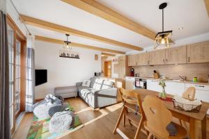 a living room with a couch and a table at Ferienwohnung Holzfäller in Lenzkirch