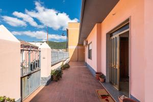 a walkway between two buildings on a balcony at Casa Vacanze Teulada in Teulada