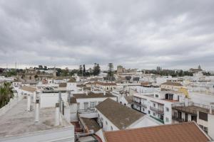 a view of a city with white buildings at Duplex a 9 min De Bajo de Guia in Sanlúcar de Barrameda
