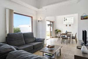 a living room with a couch and a table at Casa Elian in Lanzarote