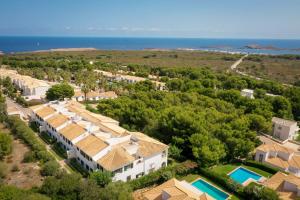 an aerial view of a villa with a resort at Villa Orchidée - Coves Noves in Punta Grossa