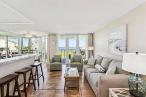 a living room with a couch and a table at Santa Rosa Dunes 923 in Pensacola Beach