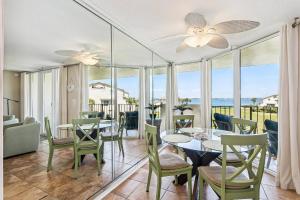 a dining room with a view of the ocean at Santa Rosa Dunes 923 in Pensacola Beach