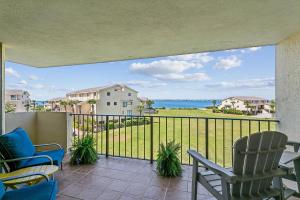 a balcony with chairs and a view of the ocean at Santa Rosa Dunes 923 in Pensacola Beach +32 photos