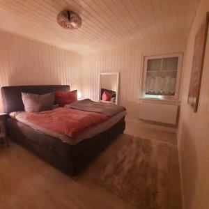 a bedroom with a bed in a room with a window at Haus Abendsonne in Wandlitz +8 photos