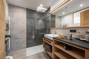 a bathroom with a shower and a sink at Apartment Mittermanting Villnöss in Villnoss +37 photos
