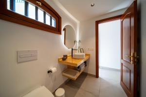 a bathroom with a sink and a mirror at Mar in Playa Honda +27 photos