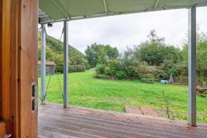 an open porch with a view of a yard at Alte Mühle in Dernbach in Dernbach