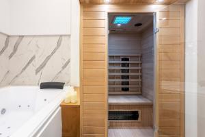 a bathroom with a walk in shower next to a sink at Piccolo Incanto Spa Palermo in Palermo