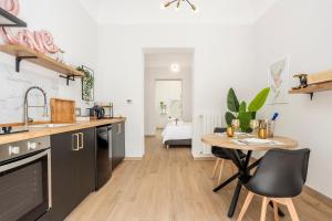 a kitchen with a table and a dining room at Piccolo Incanto Spa Palermo in Palermo +16 photos