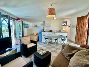 a living room with a couch and a table at La Casa Turquesa in Frigiliana