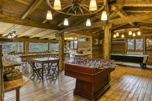a lodge with a pool table and a billiard room at Habitacions Mas Fuselles in Girona