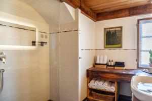 a bathroom with a shower and a sink at Ferienwohnung siebzehn35 in Garmisch-Partenkirchen +27 photos
