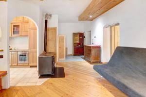 a living room with a ramp in the middle of it at Premesan 5 in Bormio +8 photos