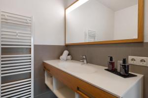 a bathroom with a sink and a mirror at Landhaus Antonius Eppan in Appiano sulla Strada del Vino +73 photos