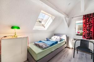 a small room with a bed and a window at Ferienhaus bei Reichsburg Cochem in Cochem