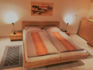 a bed with two pillows on it in a room at Viktoria in Koblenz