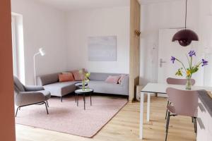 a living room with a couch and a table at Kajüte in Böhl