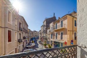 a view from a balcony of a street with buildings at Appart - Sète quartier des Artistes in Sète