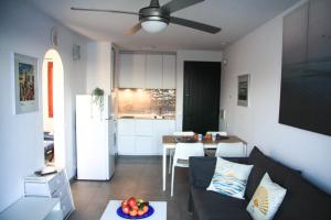 a living room with a couch and a table at Sol Isla - Binimar in Arenal d'en Castell