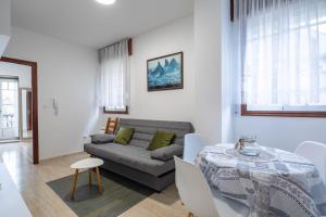 a living room with a couch and a table at Valle Inclan in Villanueva de Arosa