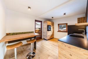 a kitchen with a counter and a counter top at Naturoase Stegerhof Apt Sonnenblume in Trodena