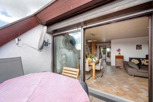 a room with a bedroom and a living room at Großzügige Maisonettewohnung in Sindelfingen