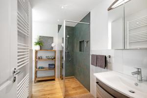 a bathroom with a shower and a sink at Ferienhaus Weltenbummler in Pepelow +34 photos