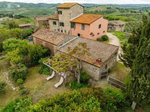 an aerial view of an old house with a tree at Vallone di Cecione in Greve in Chianti