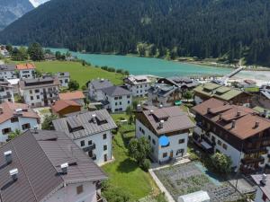an aerial view of a village with a lake at Ciasa Da Rin in Auronzo di Cadore
