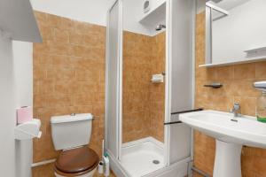a bathroom with a shower and a toilet and a sink at Le Mas Berliat N°9 in Bormes-les-Mimosas
