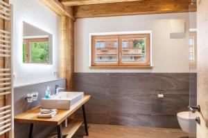 a bathroom with a sink and a mirror at Mountainlodge in Leutasch +71 photos