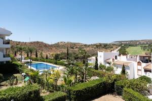 a view of a villa with a swimming pool at Apartamento Los Iris in Mijas