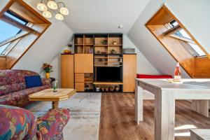 a living room with a couch and a table at Ferienwohnungen in Starsow in Mirow
