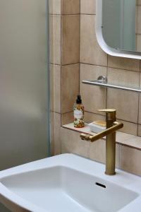 a bathroom sink with a faucet and a mirror at Biburg86420 in Biburg +19 photos