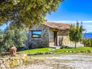 a stone house with a fire hydrant in front of it at Le Buccole Country House in Marsciano