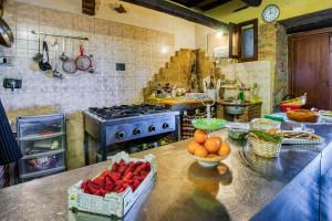 a kitchen with a counter with fruit on it at Le Buccole Country House in Marsciano