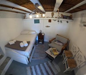 an overhead view of a room with a bed and a couch at Seagull Syros Seaside in Ermoupoli