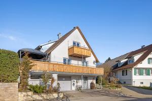 a house with a balcony on top of it at Caroline Magg in Lindau